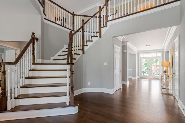 Two-story residential foyer photographed for an MLS listing