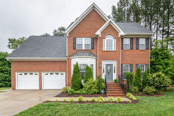 Brick colonial home exterior photographed for a residential listing