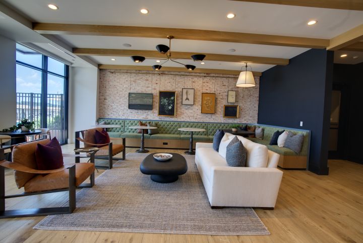 Apartment lounge with large windows photographed for property marketing